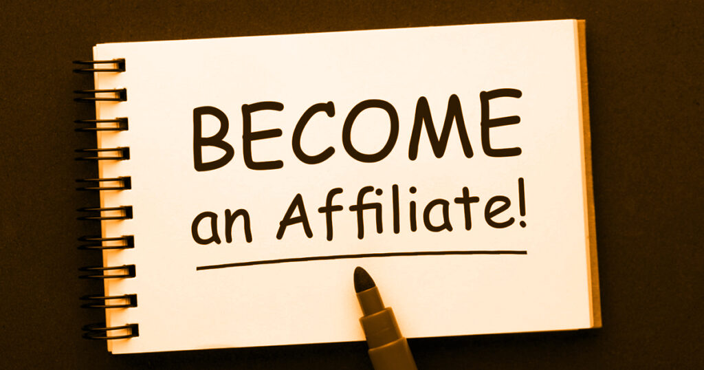 Notebook page with the words “Become an Affiliate!” written in bold black marker, placed beside a marker pen.
